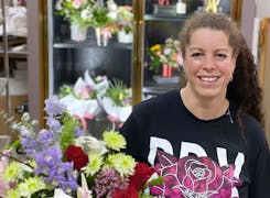 Browsing the wares of our flower cooler with the Wishing Well's owner, Selena Ross
